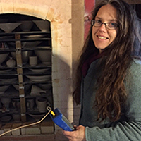 headshot of Jennifer Allen at Kris's kiln