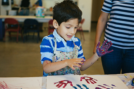 boy finger painting