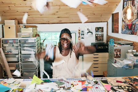 mickalene thomas in an art studio throwing paper