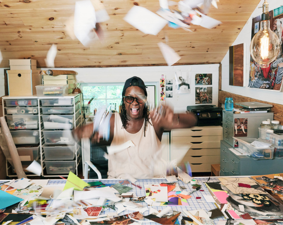 mickalene thomas throwing paper at the camera in an art studio