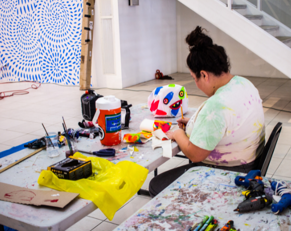 Artist Felici Asteinza working on the MILAGROS Project Atrium installation