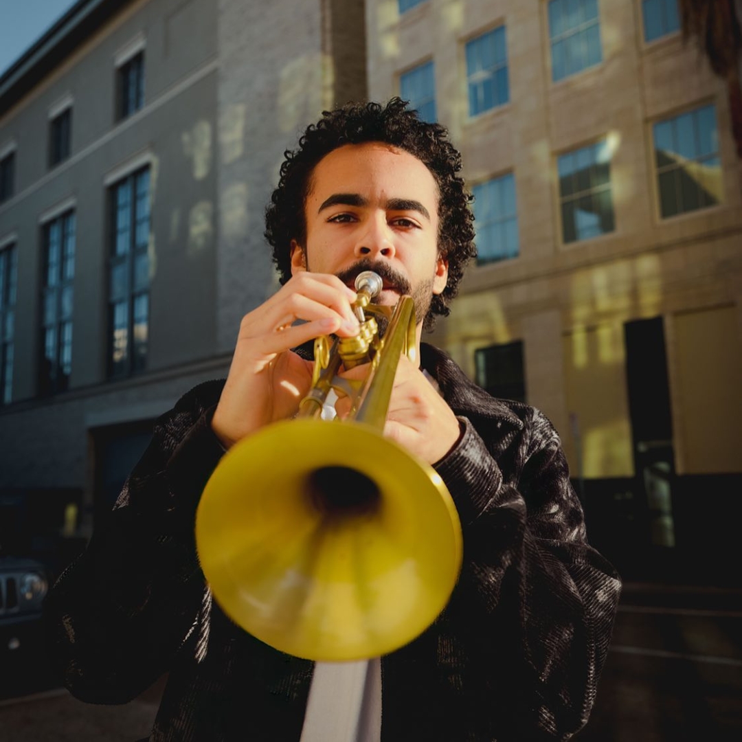 Jazz Musician Oliver Langston Playing a Trumpet