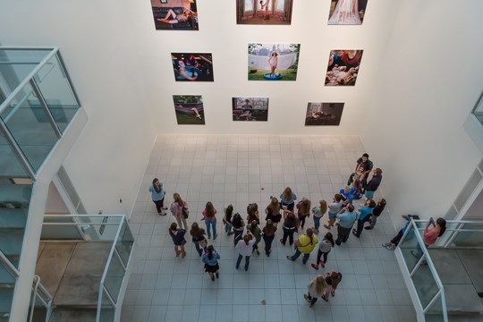 birds eye view of a group of visitors looking at the project